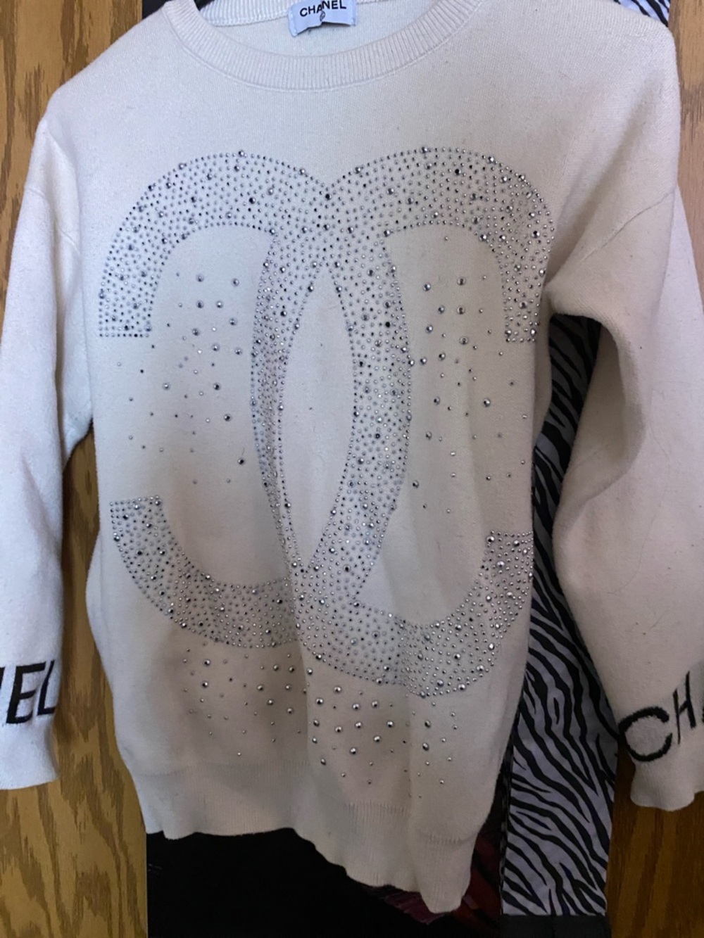 CHANEL Cream Sweater with Crystal CC Logo